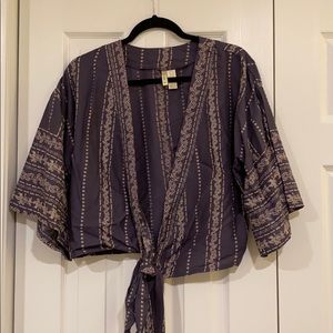 Never been worn. Blue blouse with tie